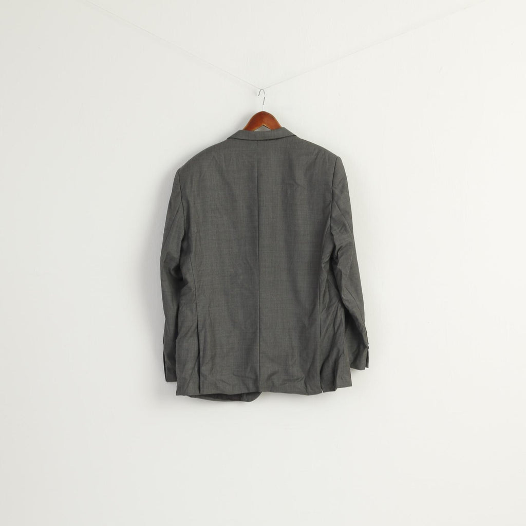 Gray jacket on a hanger against a white background
