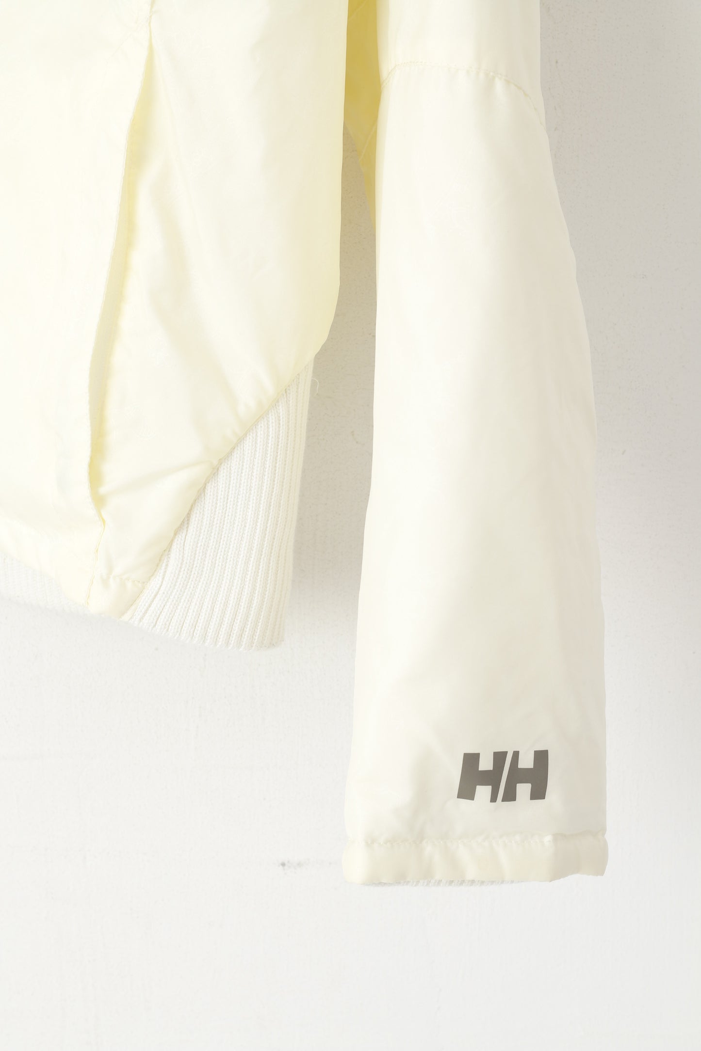 Giacca Helly Hansen Wome L Bomber color crema in nylon impermeabile con motivo floreale corto HH