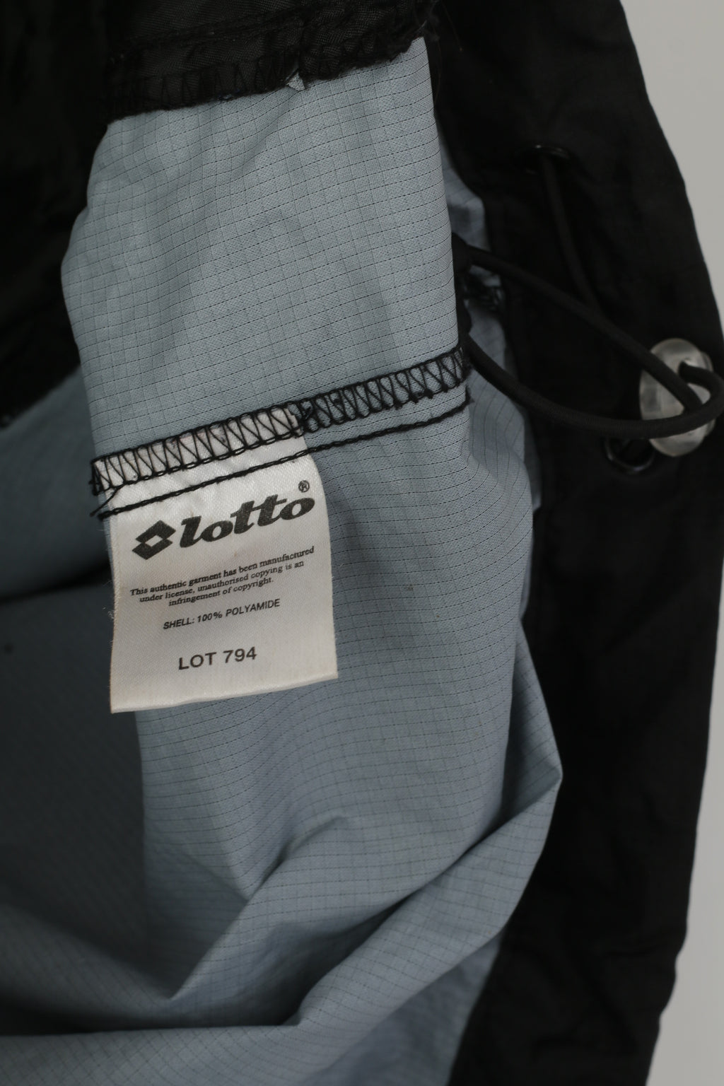 Lotto Veste pour homme en nylon noir imperméable avec capuche cachée